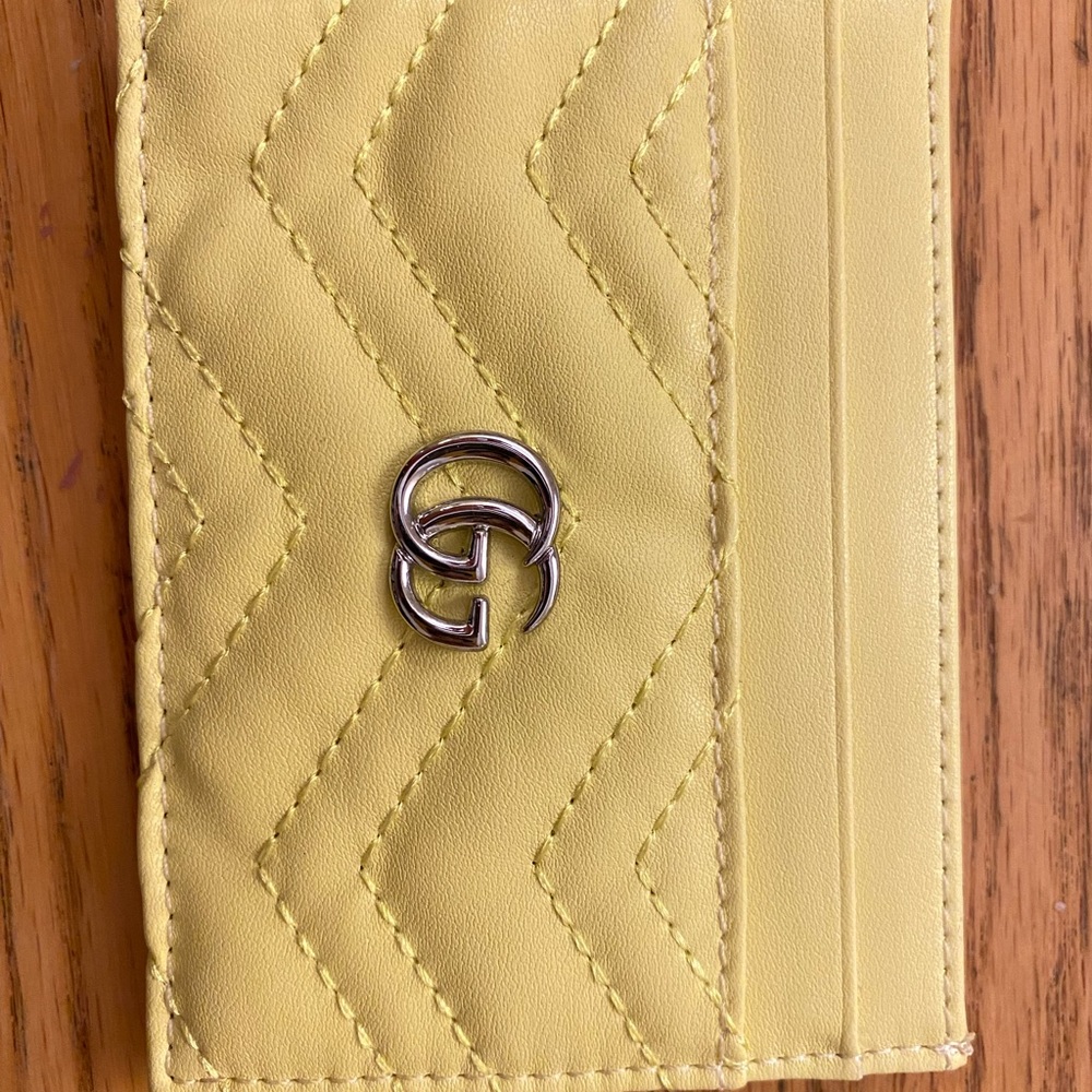 Leather card holder, never used comes with dust bag, and box
